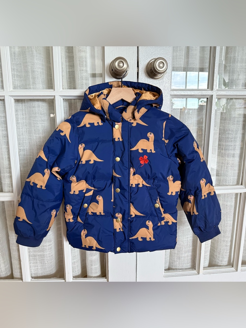 Mini Rodini Blue Puffer Jacket with Tan Dinosaur Print